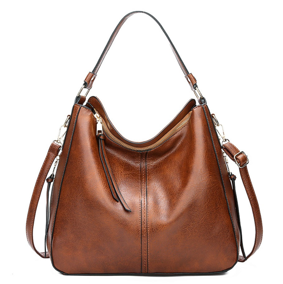 Elegant Genuine Leather Handbag – The Essence of Refinement